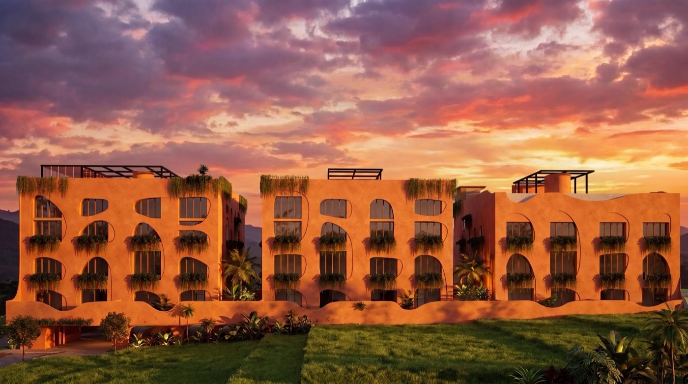Three low-rise buildings at sunset